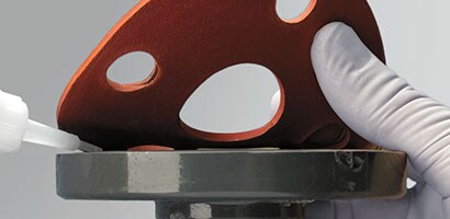 Gasket adhesive for industrial applications
