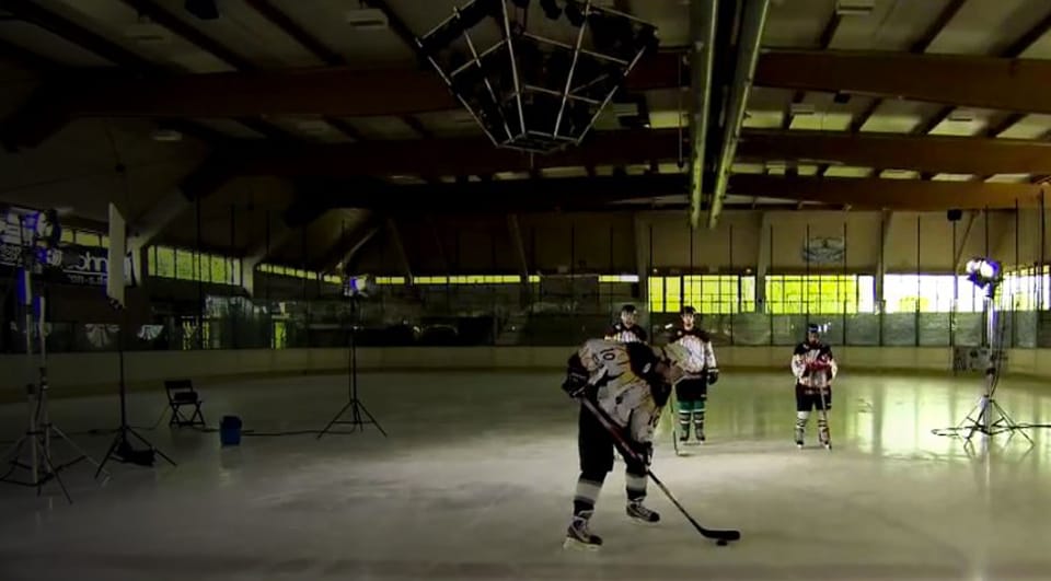Hockey players line up on the ice to take shots at breaking the glass and test the strength of 3M product, ETFE.
