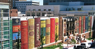 Outside of the Kansas City Central Library parking lot, wrapped in 3M Controltac Graphic Film, to appear like a giant row of books.