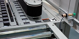 Imagen en primer plano de la correa de tracción en una selladora de cajas 3M-Matic™.
