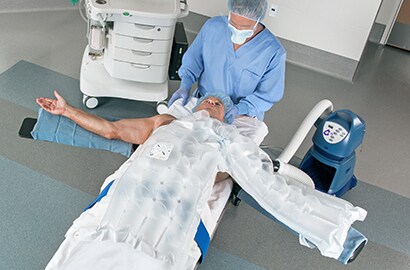 Patient is prepared for surgery with warming gown.
