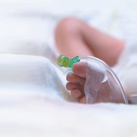 Infant foot with securement tape