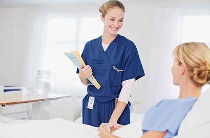 A nurse with a patient in the hospital.
