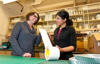 Corporate 3M scientist, Jayshree Seth working with another employee at 3M