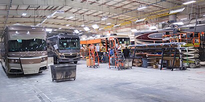 RV manufacturing plant showing RVs made with industrial adhesives
