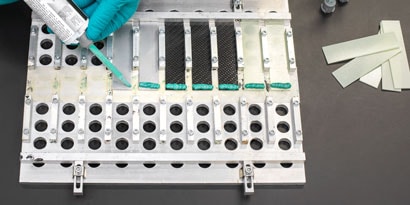Urethane Adhesive being applied to object
