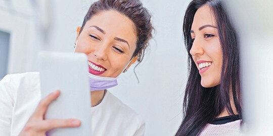 Two women discussing treatment plan

