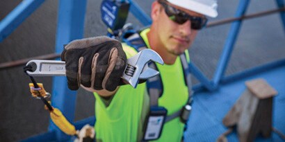 Man ywearing 3M Fall Protection to prevent Dropped Objects 
