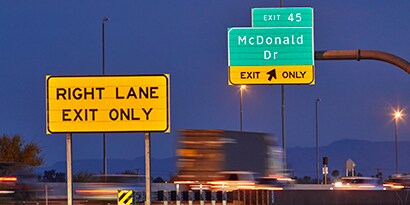 Retroreflective roadway signs at night
