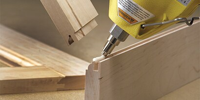 Applying wood bonding glue on wooden trim
